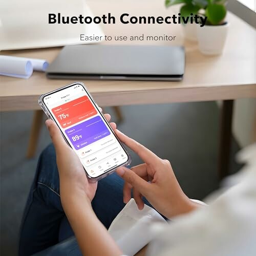 Person using smartphone app with Bluetooth connectivity