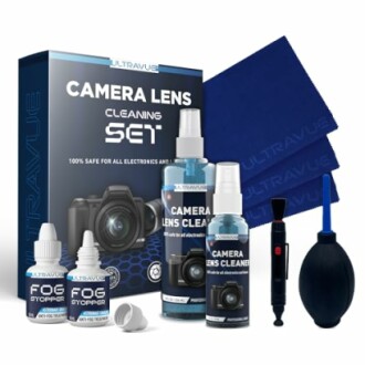 Camera lens cleaning set with solutions, cloths, and tools.