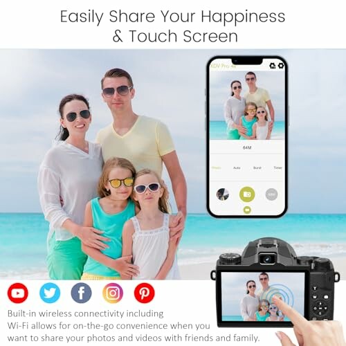 Family on beach using camera with touch screen and wireless sharing features.