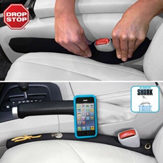 Car seat gap filler preventing items from falling between seats.