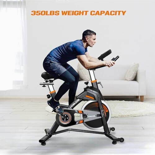 Person using exercise bike with 350lbs weight capacity
