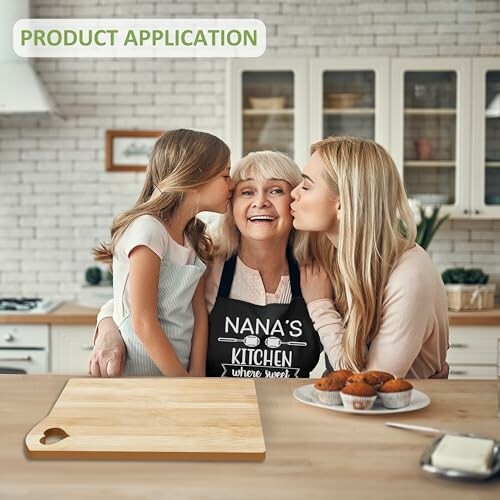 Grandmother with apron being kissed by daughter and granddaughter in kitchen