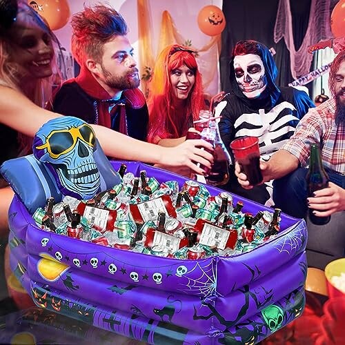 Group in costumes enjoying a Halloween party with a cooler full of drinks.