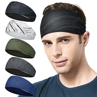 Man wearing a black headband with four additional headbands in different colors displayed.