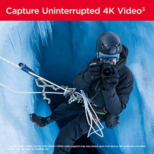 Ice climber recording 4K video with camera