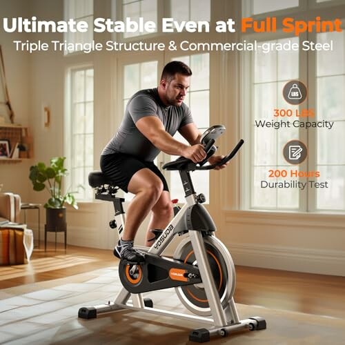 Man riding a stable indoor exercise bike with high weight capacity and durability.