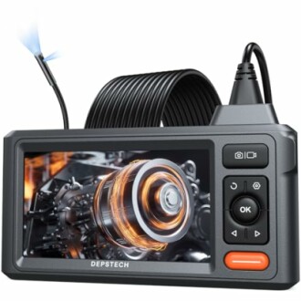 Industrial endoscope with display showing machinery inside view.