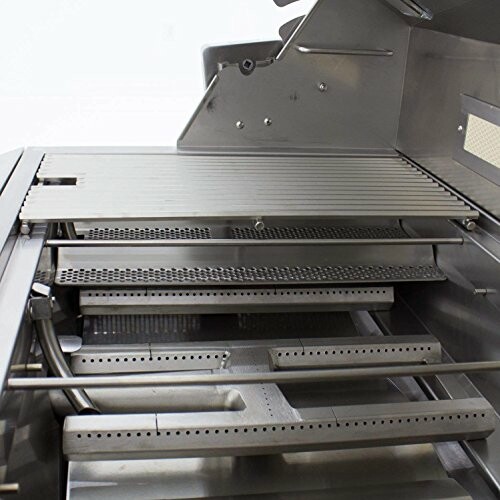 Interior of an industrial oven with metal racks and heating elements