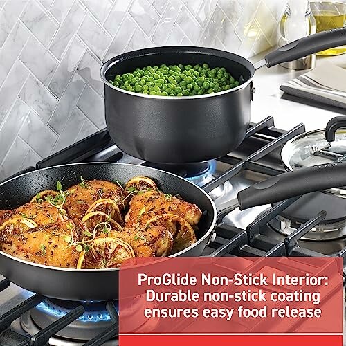 Non-stick cookware with chicken and peas cooking on a stove.