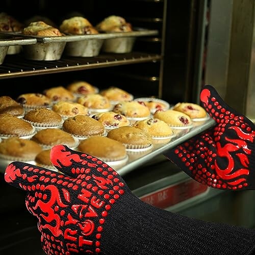 Person using oven mitts to remove muffins from oven