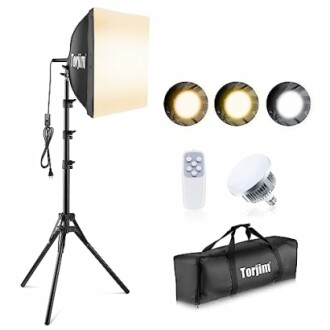 Photography lighting kit with softbox, light bulbs, remote, and carry bag.