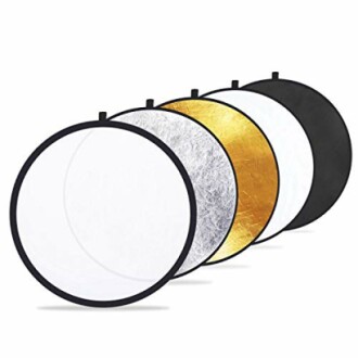 Set of five photography light reflectors in various colors.