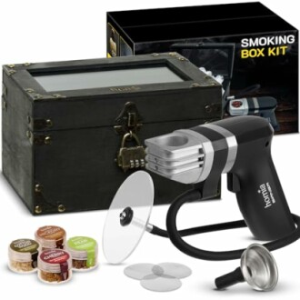 Smoking box kit with accessories including a smoking gun, wood chips, and a storage box.