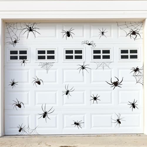 Garage door decorated with spider and web stickers.