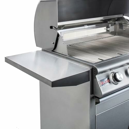 Stainless steel gas grill with open lid and side shelf