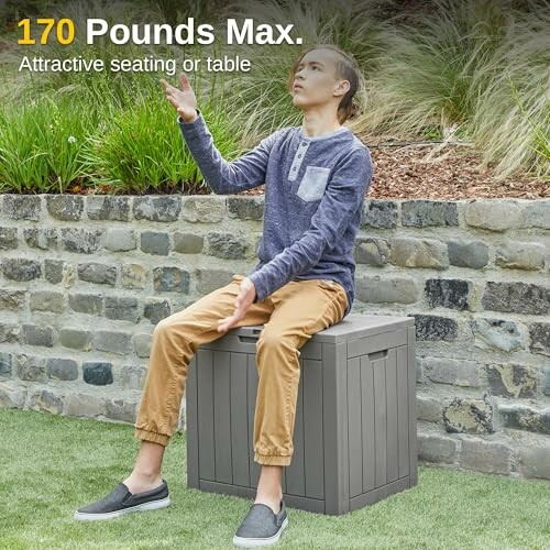 Person sitting on a storage box outdoors, labeled 170 pounds max.