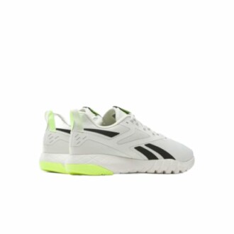White sneakers with black stripes and green accents