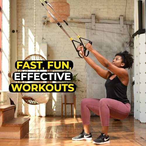 Woman performing TRX workout indoors