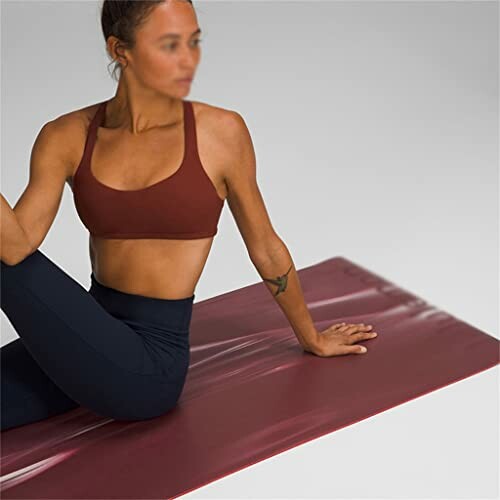 Woman in a yoga pose on a mat
