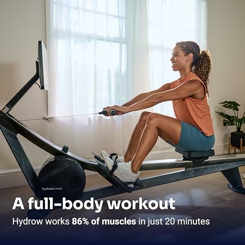Woman exercising on a rowing machine indoors.