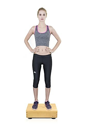 Woman standing on a wooden platform exercise box.