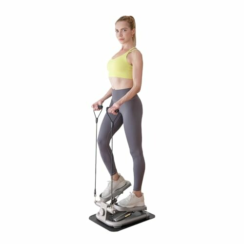 Woman exercising on a stepper machine with resistance bands.